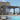 Modern pergola with glass walls next to a pool