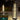 Decorative outdoor lamps on a patio with rain falling