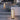 Decorative outdoor lamps on a patio with a fireplace in the background