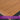 Wooden surface with a natural grain appearance and text about maintenance requirements.