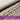 Close-up of hand-woven resin wicker with a blurred background