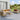 Outdoor patio furniture set with beige cushions on a wooden deck.