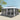 Grand Patio 13'x20' gazebo with a double vent canopy and netting, featuring a gray color and open design.