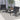 Outdoor furniture set with two chairs and a small table on a patio.