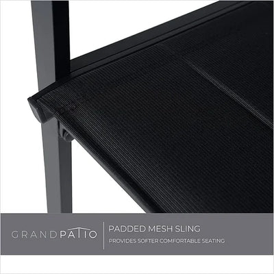 Close-up of a black padded mesh sling chair with 'Grand patio' branding.