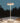 White LED desk lamp on a wooden surface with a dark background