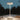 White LED desk lamp on a wooden surface with a dark background