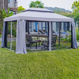 Outdoor gazebo with curtains on a grassy area