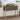 Gray planter box with wooden frame filled with flowers on a wooden deck.