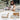 Grand Patio wicker patio furniture set featuring a woman reading on a chair with soft cushions and a coffee table.