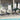 Outdoor patio furniture set on a deck by a pool