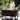 Woman preparing food on a portable outdoor kitchen in a garden setting