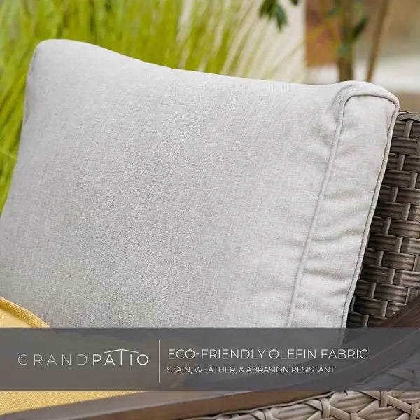 Gray cushion on a wicker chair with 'GrandPatio' branding and text about eco-friendly olefin fabric.