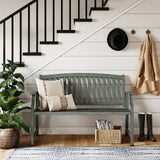 Grand Patio outdoor bench in faux wood finish, set against a white wall with stairs, plants, and decorative items.