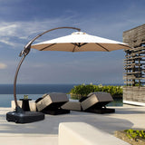 Grand Patio 11 ft cantilever patio umbrella with a beige canopy and a black base, positioned by a poolside lounge area.