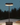 Outdoor lamp on a wooden surface with a dark background