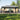 Grand Patio 13'x20' gazebo with a double vent canopy and netting, featuring gray fabric and a spacious seating area.