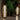 Decorative outdoor lamps with a warm glow in a garden setting.