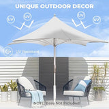 Grand Patio 11 ft sunshade umbrella in white with a pulley lift, set beside two chairs on a patio.
