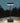 Modern outdoor lamp on a wooden surface with a dark background