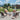 Outdoor patio set with chairs and table in a scenic setting