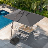 Large rectangular cantilever patio umbrella in gray, positioned over a wooden dining table with white chairs by a pool.