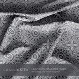 Heavy duty polyester fabric in black and white pattern, featuring circular designs and a smooth texture.