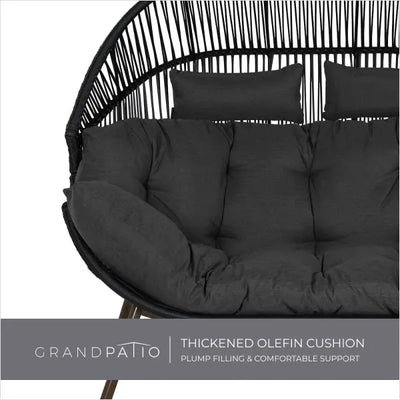 Black cushion on a wicker chair with 'GrandPatio' branding.