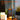 Solar yard outdoor lantern with candles on a wooden surface