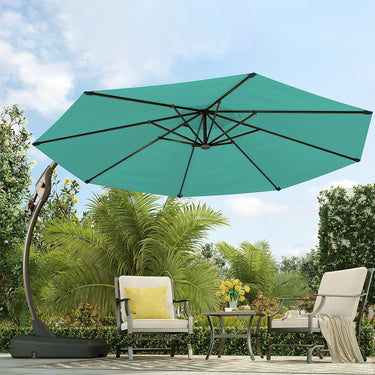 Grand Patio 12 ft Napoli cantilever umbrella in teal, positioned over a patio table and chairs surrounded by greenery.