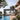 Ombra Smart Pergola with pool and garden view, labeled 'World's First Ombra Smart Pergola'.