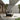 Grand Patio outdoor wicker sectional sofa set with thick gray cushions and a steel frame, placed on a patio.