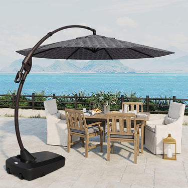 Grand Patio 11 ft cantilever patio umbrella with a black canopy, positioned over a wooden dining set by the poolside.