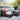 Outdoor patio furniture set with colorful cushions on a stone patio.