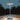 Solar-powered outdoor lamp on a wooden surface with a dark background