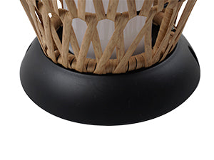 Decorative candle holder with woven top and black base on a white background