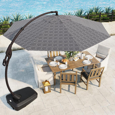 Grand Patio 11 ft cantilever patio umbrella with a round patterned canopy, set over a wooden dining table and chairs.