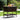 Outdoor patio cart with food and drinks on a grassy area