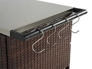 Brown wicker outdoor furniture with metal hooks on a gray surface