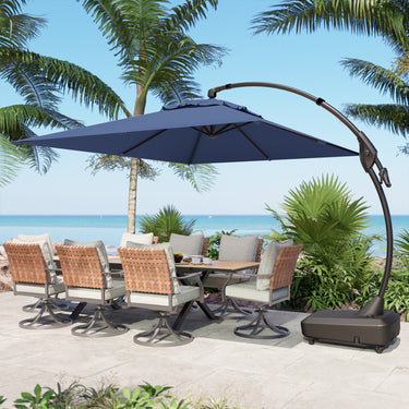 Large rectangular cantilever patio umbrella in navy blue, positioned over a dining table with six chairs in a tropical set...
