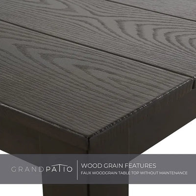 Close-up of a dark wood grain table top with 'Grand Patio' branding.