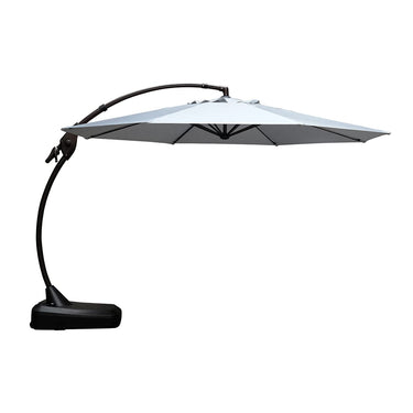 Grand patio 12 ft deluxe Napoli Sunbrella cantilever umbrella in light gray with a curved arm and sturdy base.