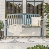 Grand Patio outdoor bench with faux wood finish, blue color, placed on a patio with a pillow and blanket.