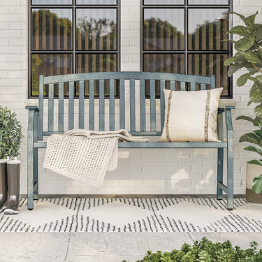 Grand Patio outdoor bench with faux wood finish, blue color, placed on a patio with a pillow and blanket.