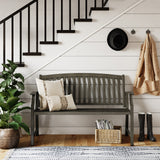 Grand Patio outdoor bench in gray with faux wood finish, placed near a staircase and surrounded by plants and decor.
