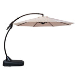 Grand Patio 12 ft Deluxe Napoli Sunbrella cantilever umbrella with a beige canopy and black curved pole and base.