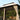 Outdoor gazebo with curtains and cushions in a garden setting