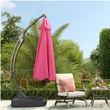 Grand Patio 11 ft cantilever patio umbrella in pink, with a sturdy base, set in a garden with greenery and outdoor furniture.