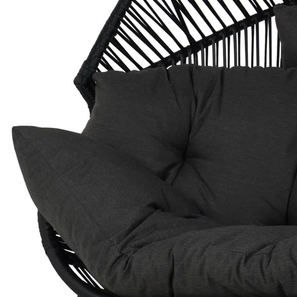 Black cushioned chair with a white background