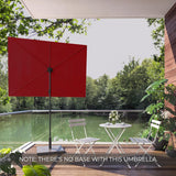 Red rectangular flat patio market umbrella on a balcony overlooking a green landscape, with white chairs and table.
